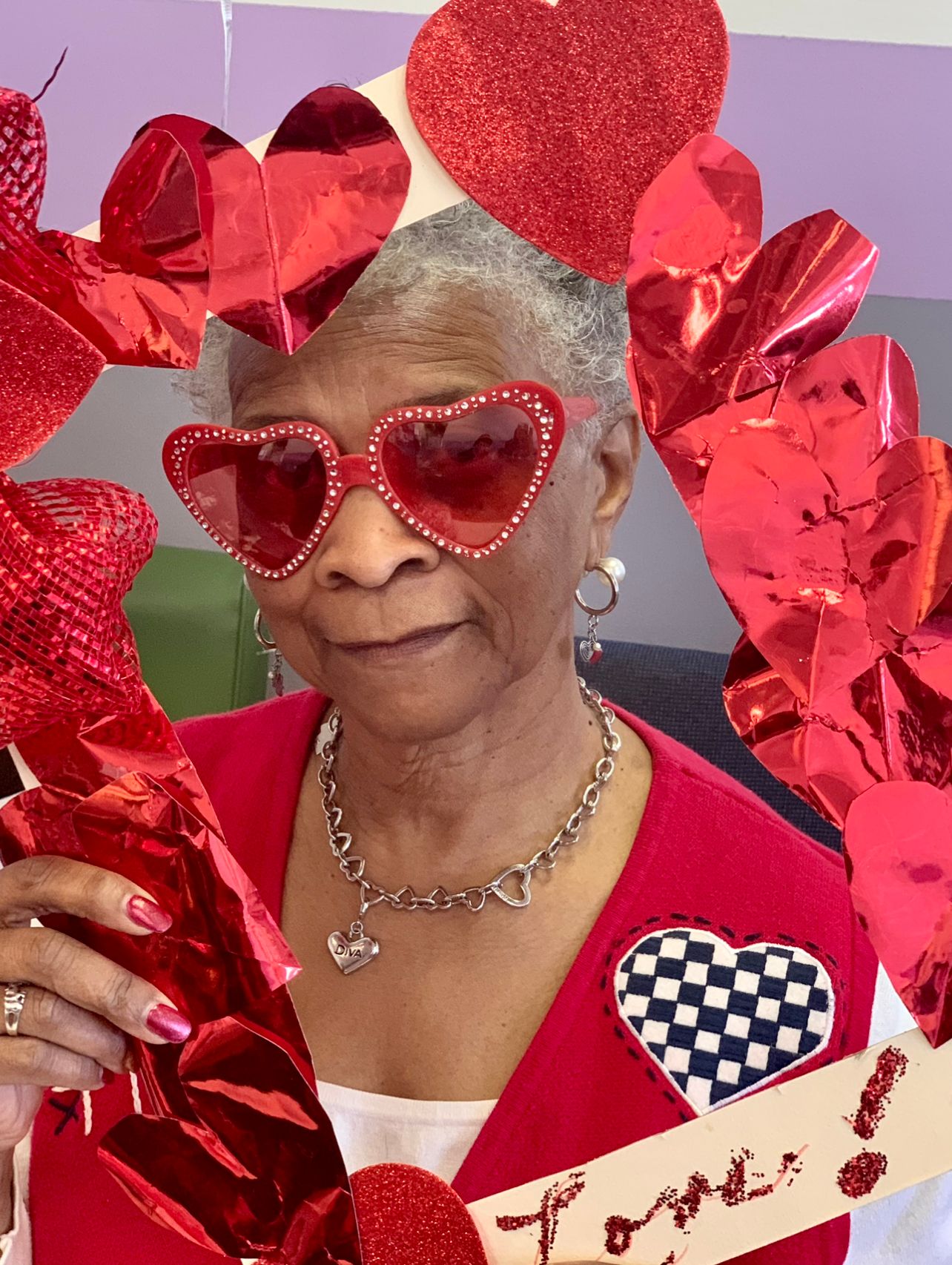 Woman with heart decoration at Central Adult Day Healthcare Services